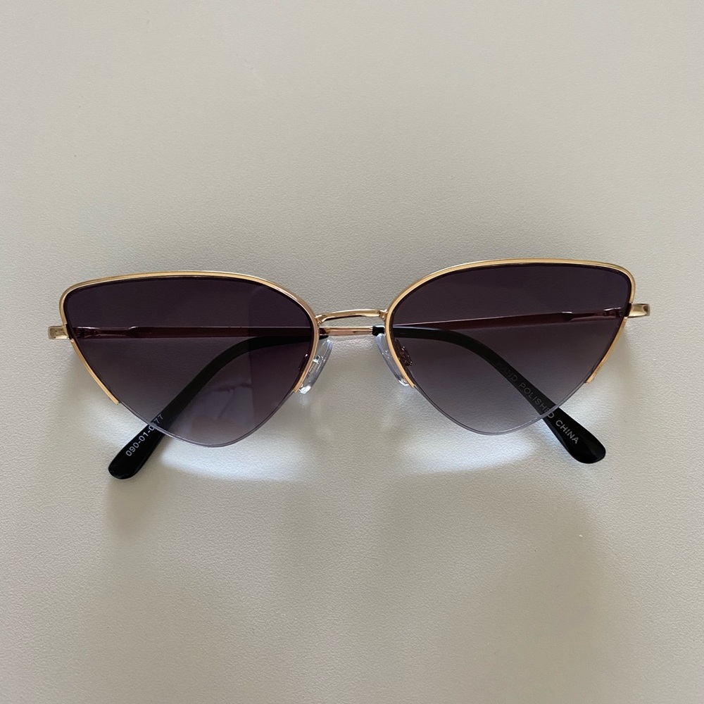 Gold framed sunglasses